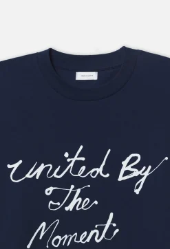 John Elliott United by the Moment Tee