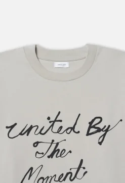 John Elliott United by the Moment Tee